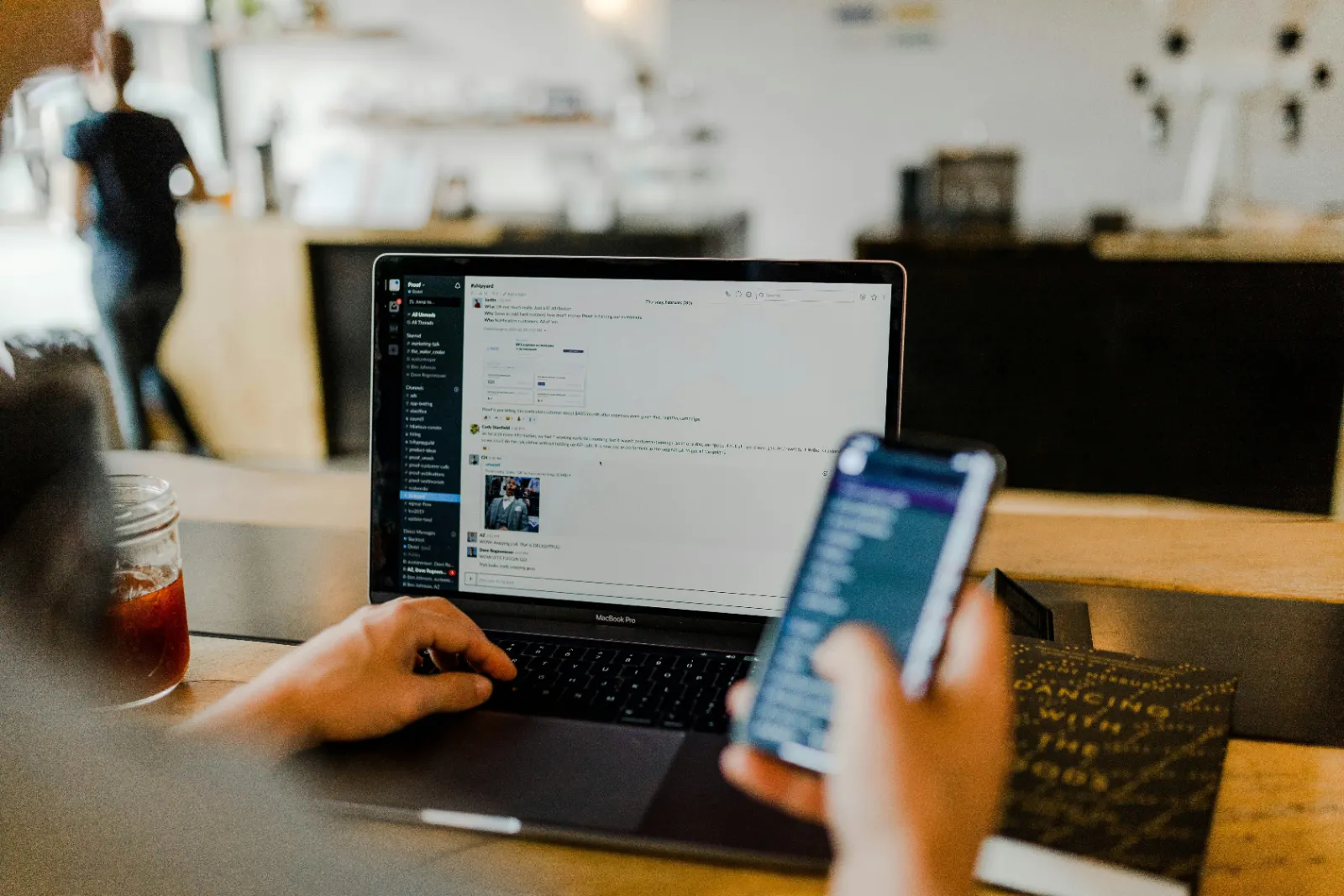 Laptop and phone on a desk for remote bookkeeping support