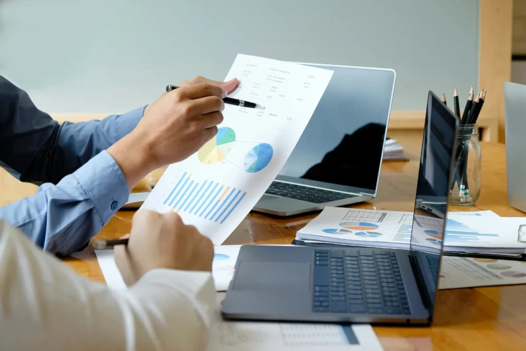 Reviewing a financial report on a laptop for a small business